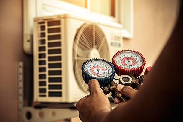 Professional Air Conditioning Service technician working in Grapeville, PA